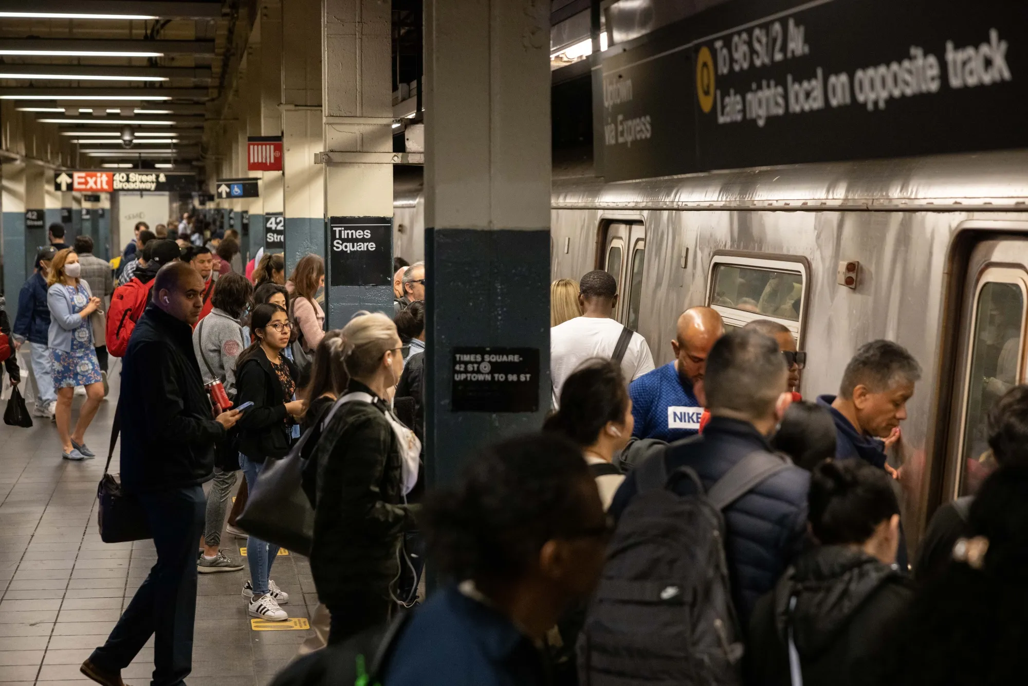 Commuters at the Times Square subway station in New York, US, on Friday, May 19, 2023.&nbsp;