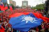 Supporters hold a giant Taiwanese flag among them during a campaign event