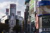 Advertisements are displayed on billboards in the Shibuya district of Tokyo, Japan, on Thursday, Nov. 16, 2017. Japan’s economy grew for a seventh straight quarter, its longest expansion since 2001, as a recovery in exports and rising business investment offset a decline in consumer spending.