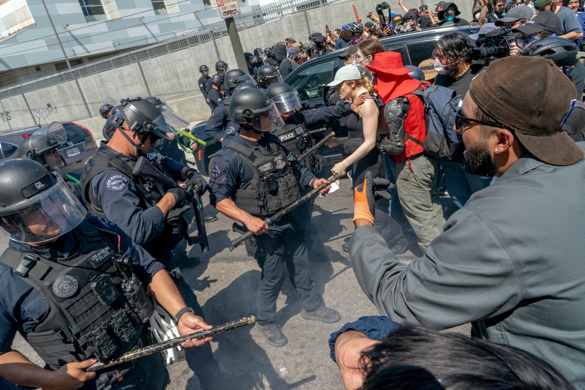 Law enforcement officers confront protesters during a demonstration in Los Angeles in June 2025. Photographer: Kyle Grillot/Bloomberg