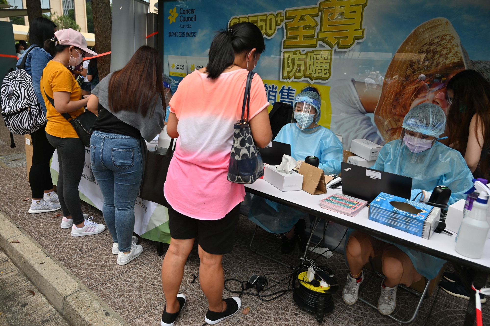Migrant workers register for Covid-19 testing in the Central district of Hong Kong on May 1.