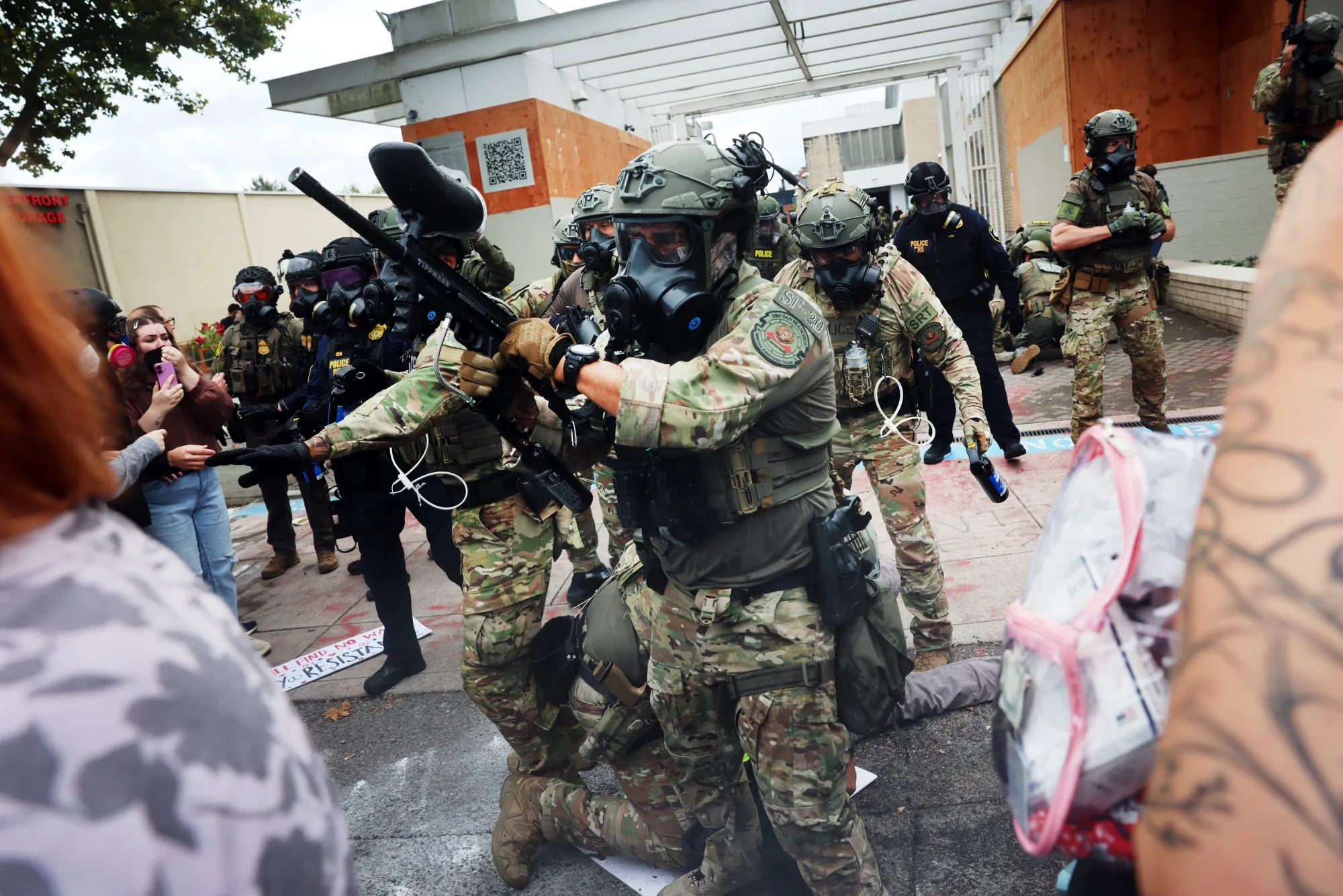 Federal agents clash with protesters outside an ICE&nbsp;facility in Portland on Oct. 4.