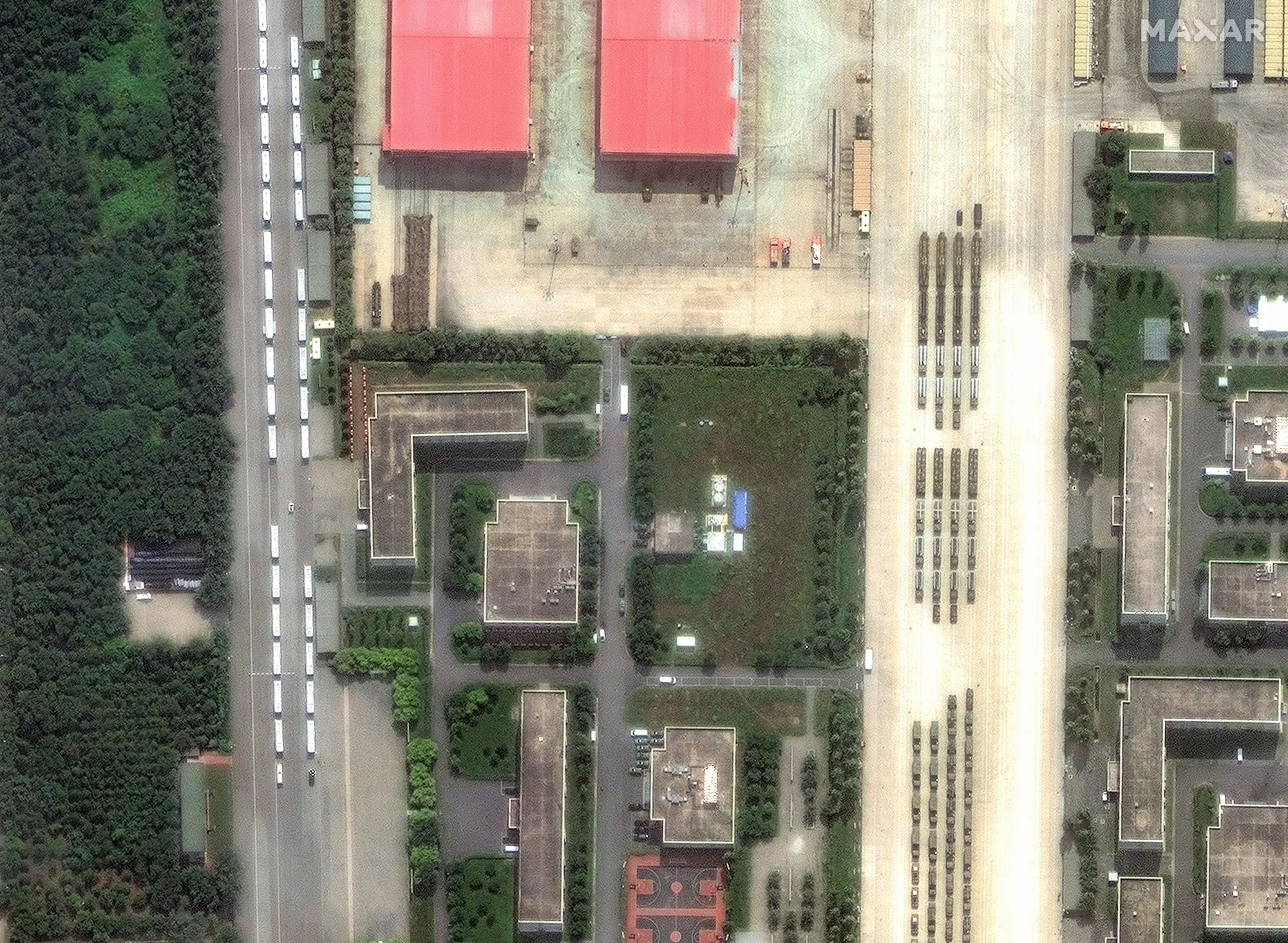 Satellite image of buses and military equipment in formation at a Chinese military base on Sept. 2.  
