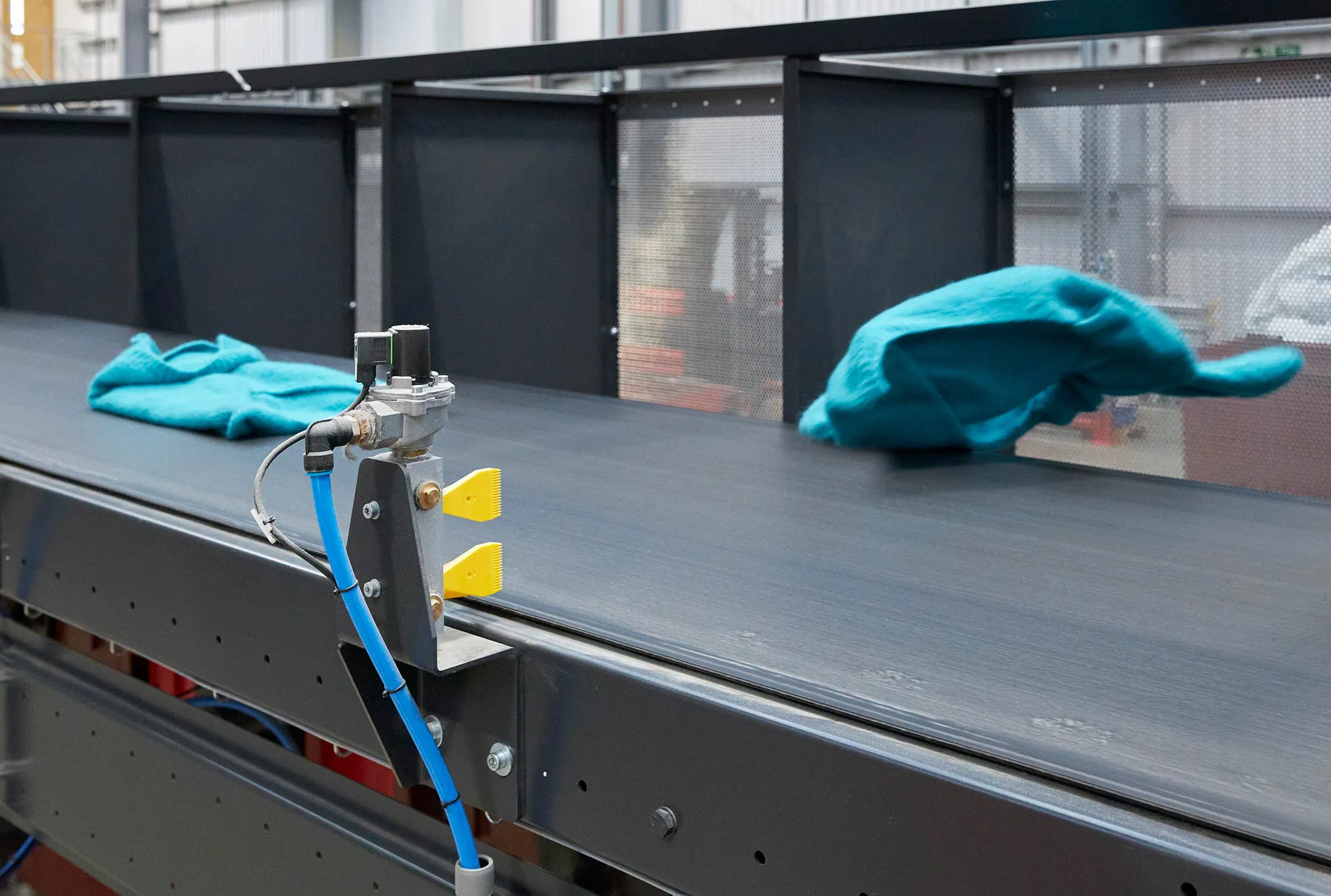 The Fibersort uses infrared scanning, machine learning and air jets to classify unwearable clothing into different fiber types for recycling.