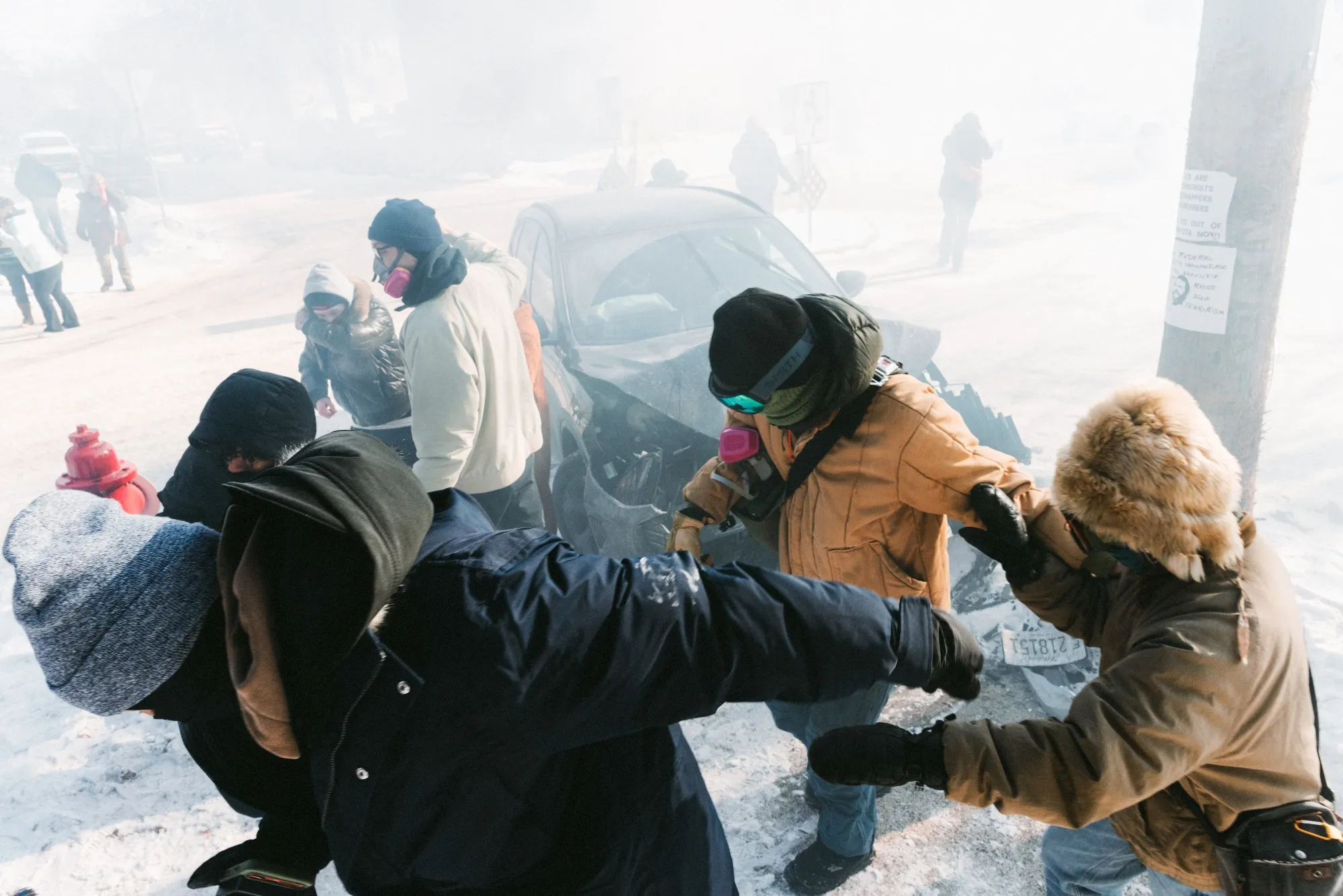Federal law enforcement agents deploy tear gas into a crowd in Minneapolis on Jan. 23.