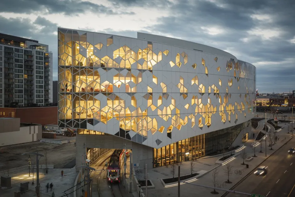 “It’s designed to allow people to walk freely between these two districts without having to enter the building,” says Craig Dykers of Snøhetta. “So, you pass through this wooden archway, over the tracks, and into the different parts of town. We’ll see a lot of people walking through this very generous public space.”