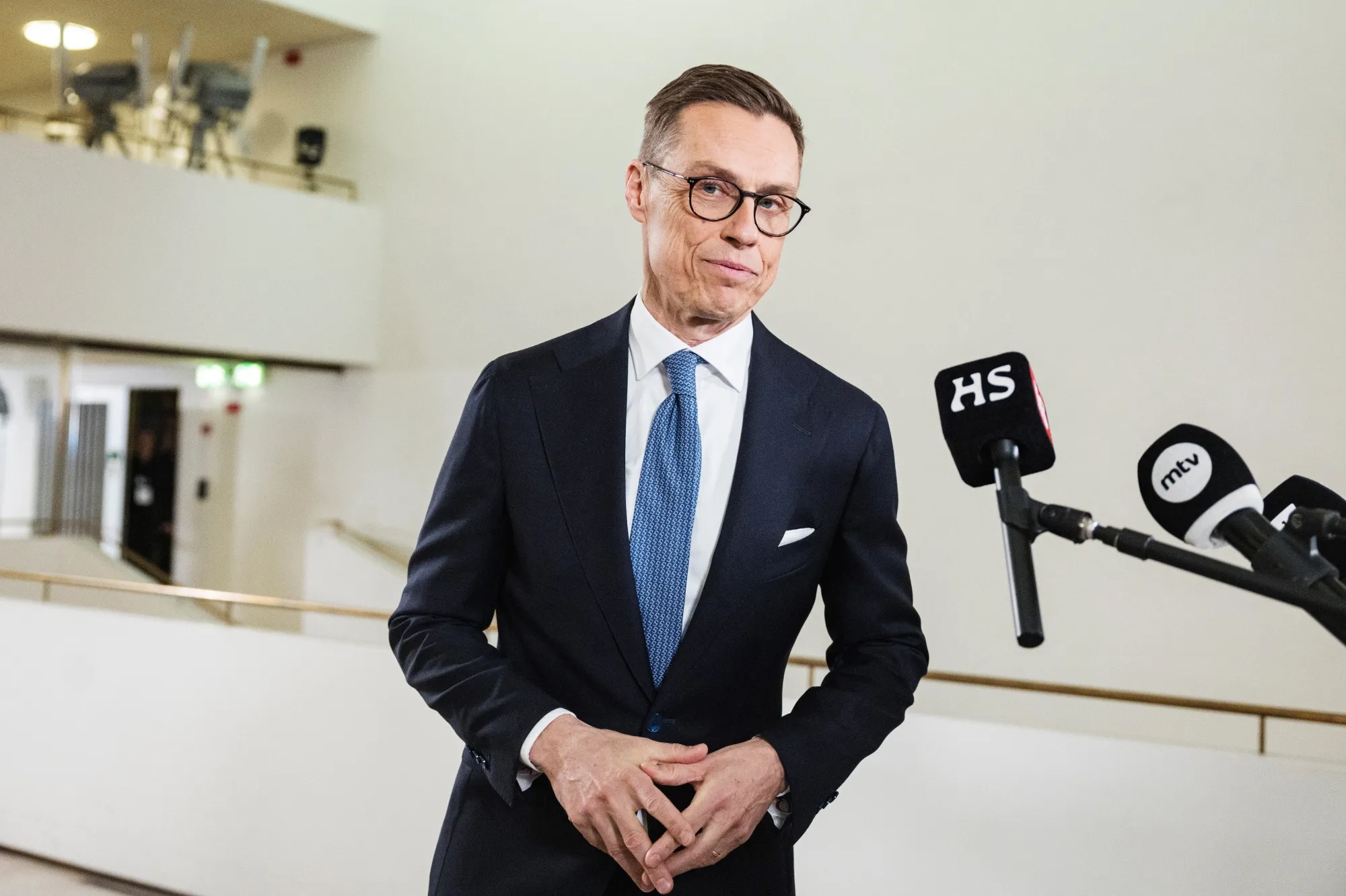 Alexander Stubb speaks to members of the media following the second round of the presidential election at Helsinki City Hall on Sunday.