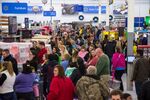 Customers shop during Black Friday promotions at a Wal-Mart store in Bentonville, Arkansas