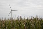 A wind turbine stands in a field in Greenfield, Iowa.