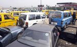 Cars jam a gasoline station waiting for fuel in Lagos, Nigeria.
