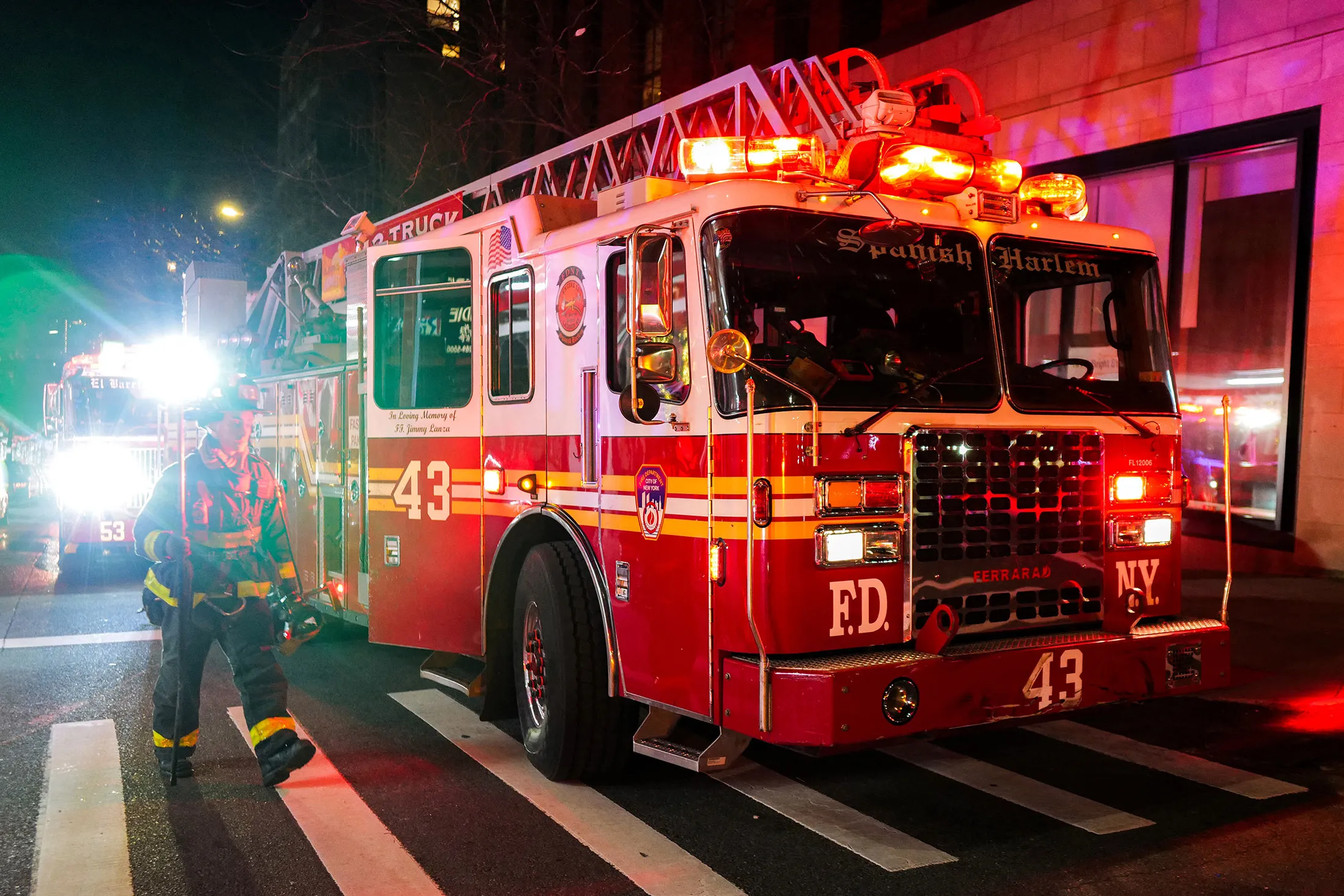 New York Fire Department firefighters work at night in the Manhattan borough of New York on Feb.&nbsp;4.