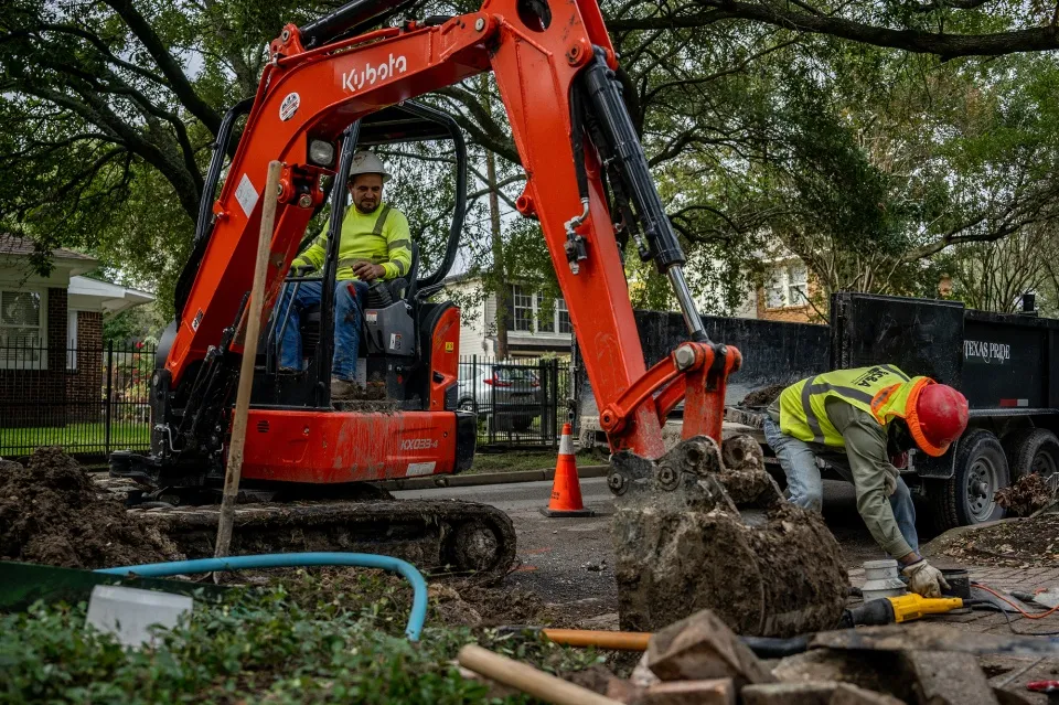 Construction workers repair a street&nbsp;in Houston, Texas.