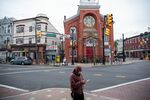 A pedestrian wears a protective mask while walking through the Ironbound district of Newark, New Jersey on May 6.