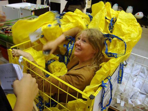 A woman takes part in a game of hide-and-seek at an IKEA store in Wilrijk, Belgium.