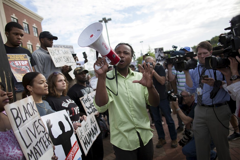 Muhiydin Moye D'Baha of the Black Lives Matter movement leads a protest in North Charleston, South Carolina.
