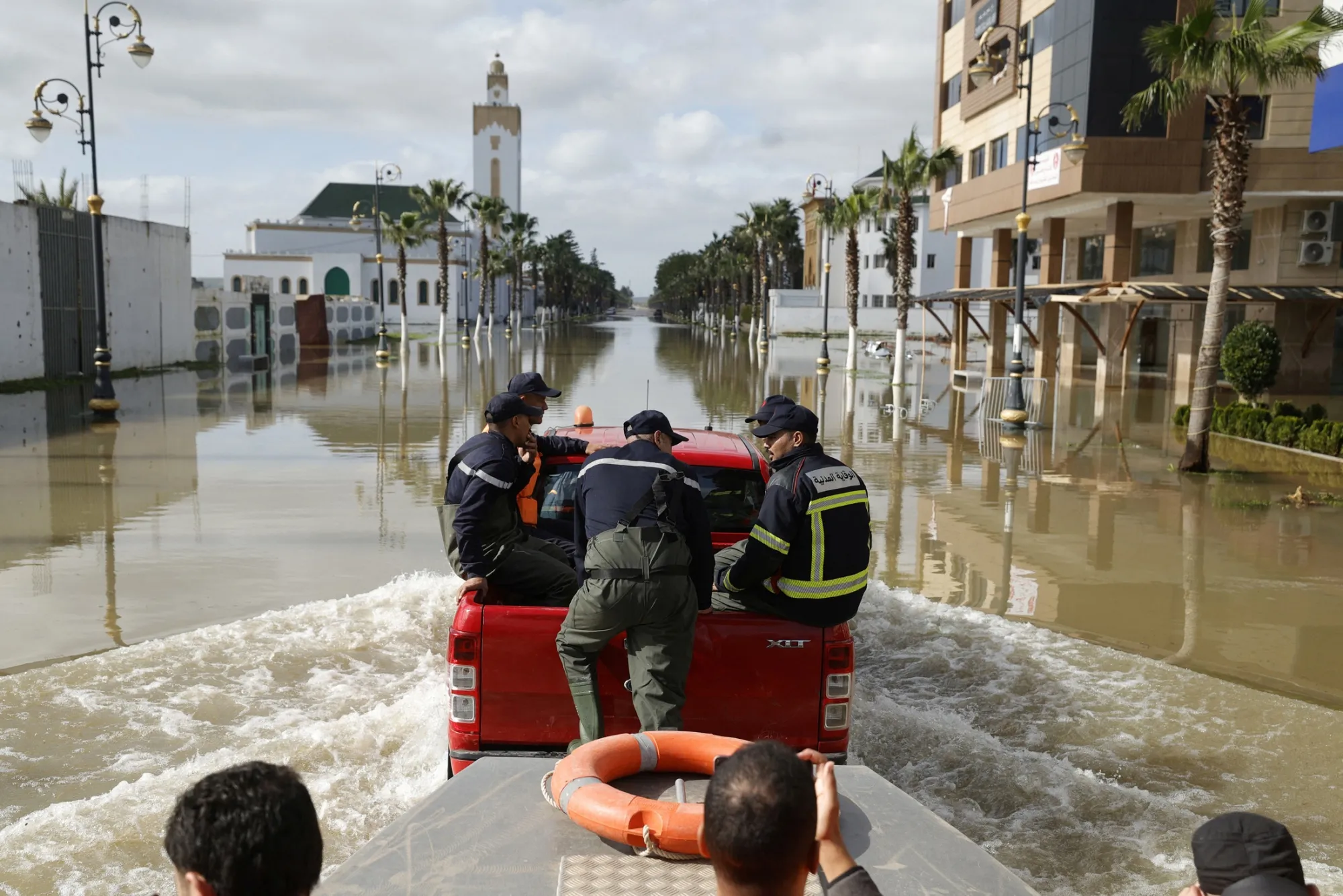 Emergency services drive through flood waters in Ksar El-Kbir, Morocco, on Feb. 1.