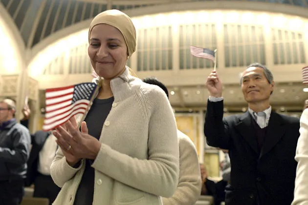 Nouran Aboelregal from Egypt is sworn in as the U.S. Citizenship and Immigration Services (USCIS) conducts a ceremony for 75 people at the New York Public Library on Sep., 17