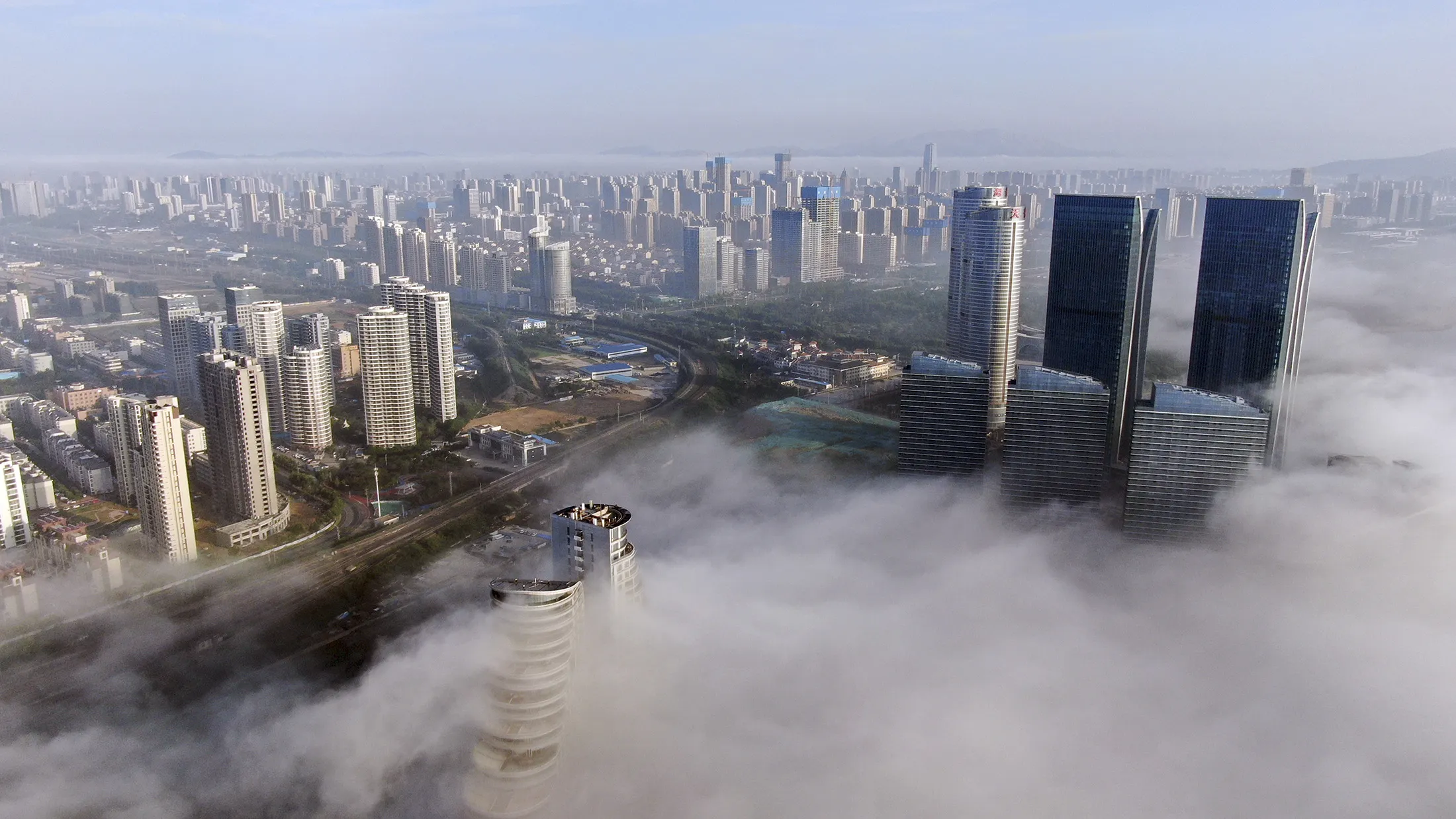 Buildings surrounded by&nbsp;fog&nbsp;in Rizhao, China.