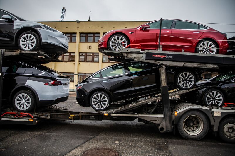 Tesla vehicles aboard a transporter truck at the Port of Oslo.