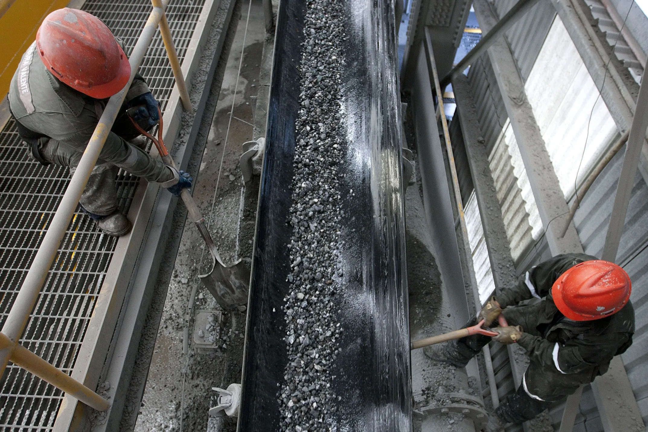Workers monitor unprocessed silver along a conveyor belt at the Fresnillo&nbsp;silver mine in Zacatecas, Mexico.