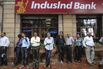 People wait&nbsp;outside a branch of IndusInd Bank Ltd., in Mumbai, India.
