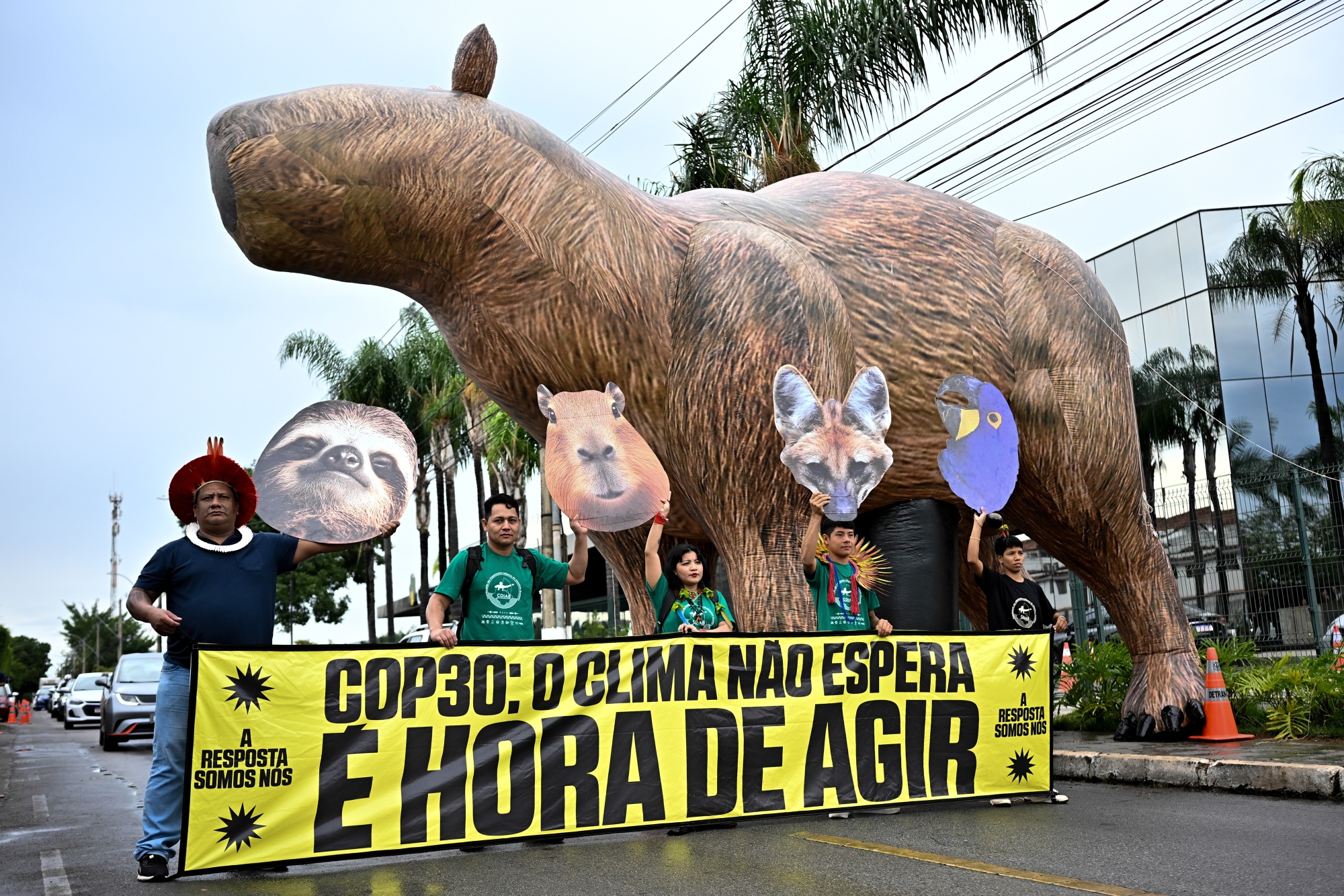 Demonstrators outside the preparatory ministerial meeting ahead of COP30, at the Brazil International Convention Center (CICB) in Brasilia, Brazil, on Tuesday, Oct. 14, 2025. Brazil is confident the World Bank will be its main partner in launching a $125 billion fund to protect tropical forests — one of the country&#39;s flagship initiatives for the COP30 climate summit in November. Photographer: Ton Molina&#x2F;Bloomberg
