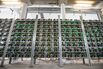Cryptocurrency mining rigs composed of Antminer S9 ASIC machines operate on racks at the HydroMiner GmbH cryptocurrency mining facility near Waidhofen an der Ybbs, Austria.