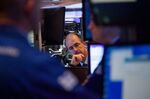 A trader works on the floor of the New York Stock Exchange (NYSE) in New York, U.S..