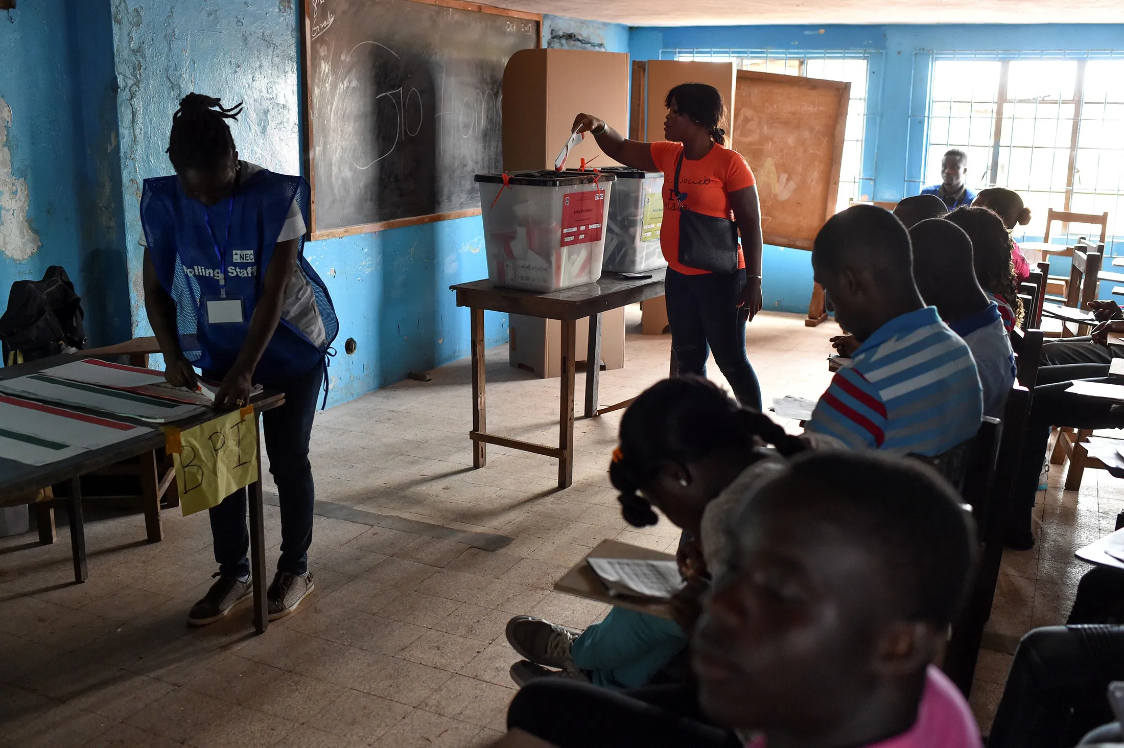 A woman casts her vote at a polling station in Monrovia during presidential elections on Oct. 10, 2017.
