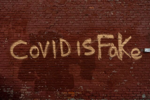 "Covid is fake" graffiti at East 146th Street and Third Avenue, Bronx