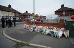 Flowers are left near to the scene of an incident in Kingsheath Avenue, Knotty Ash, Liverpool.
