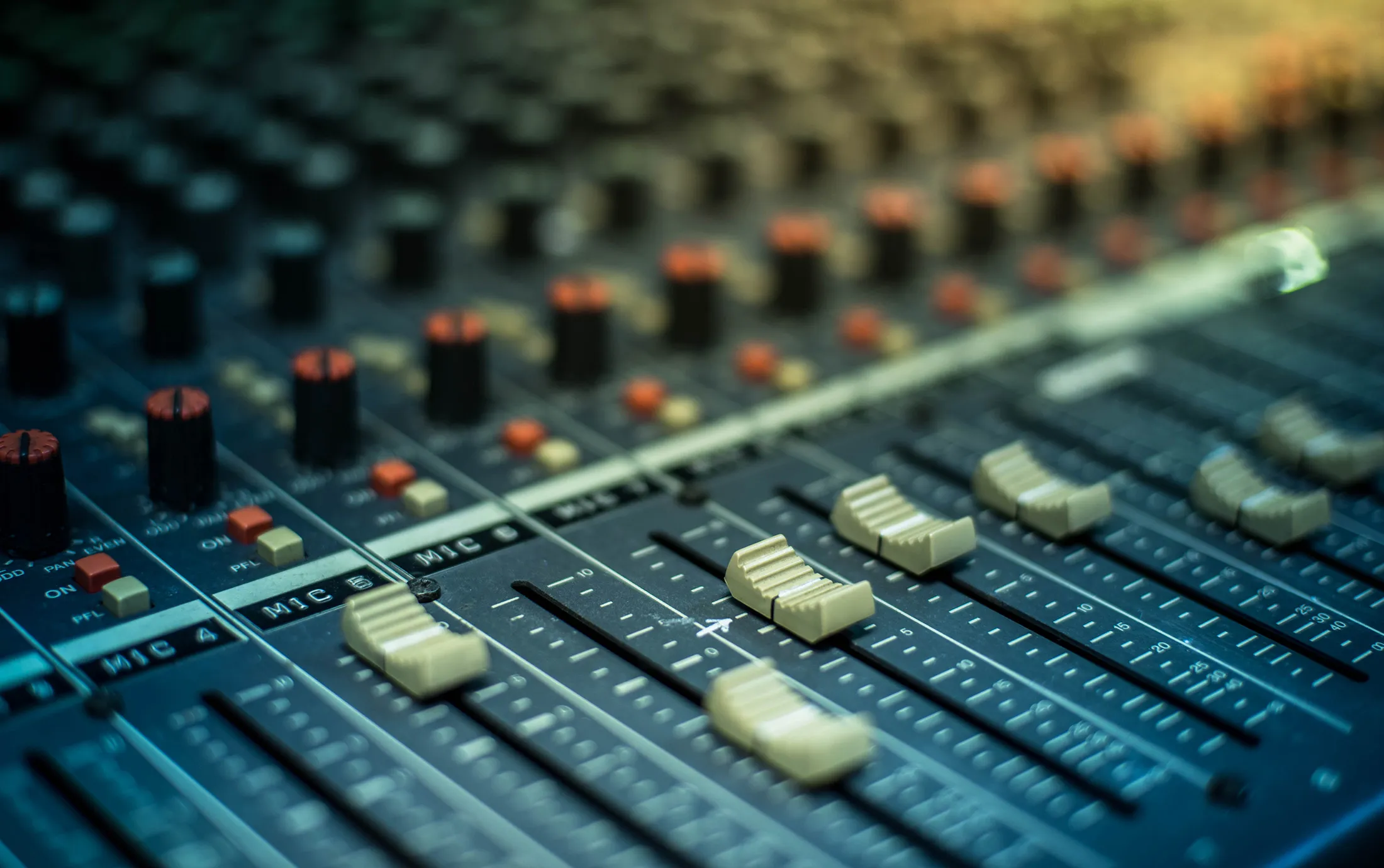 Microphone over the Abstract blurred on sound mixer out of focus background