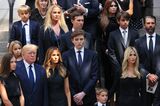 Former U.S. President Donald Trump and his wife Melania Trump along with their son Barron Trump and Ivanka Trump and their children watch as the casket of Ivana Trump is put in a hearse outside of St. Vincent Ferrer Roman Catholic Church during her funeral on July 20.
