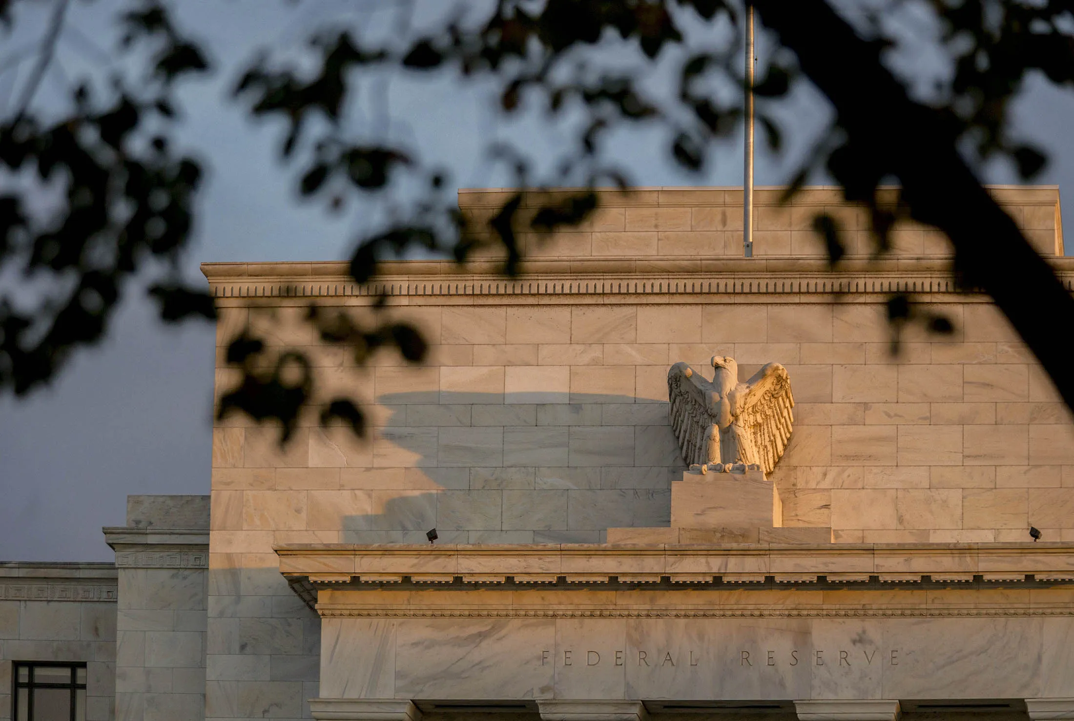 The Marriner S. Eccles Federal Reserve building stands at sunrise in Washington, D.C.
