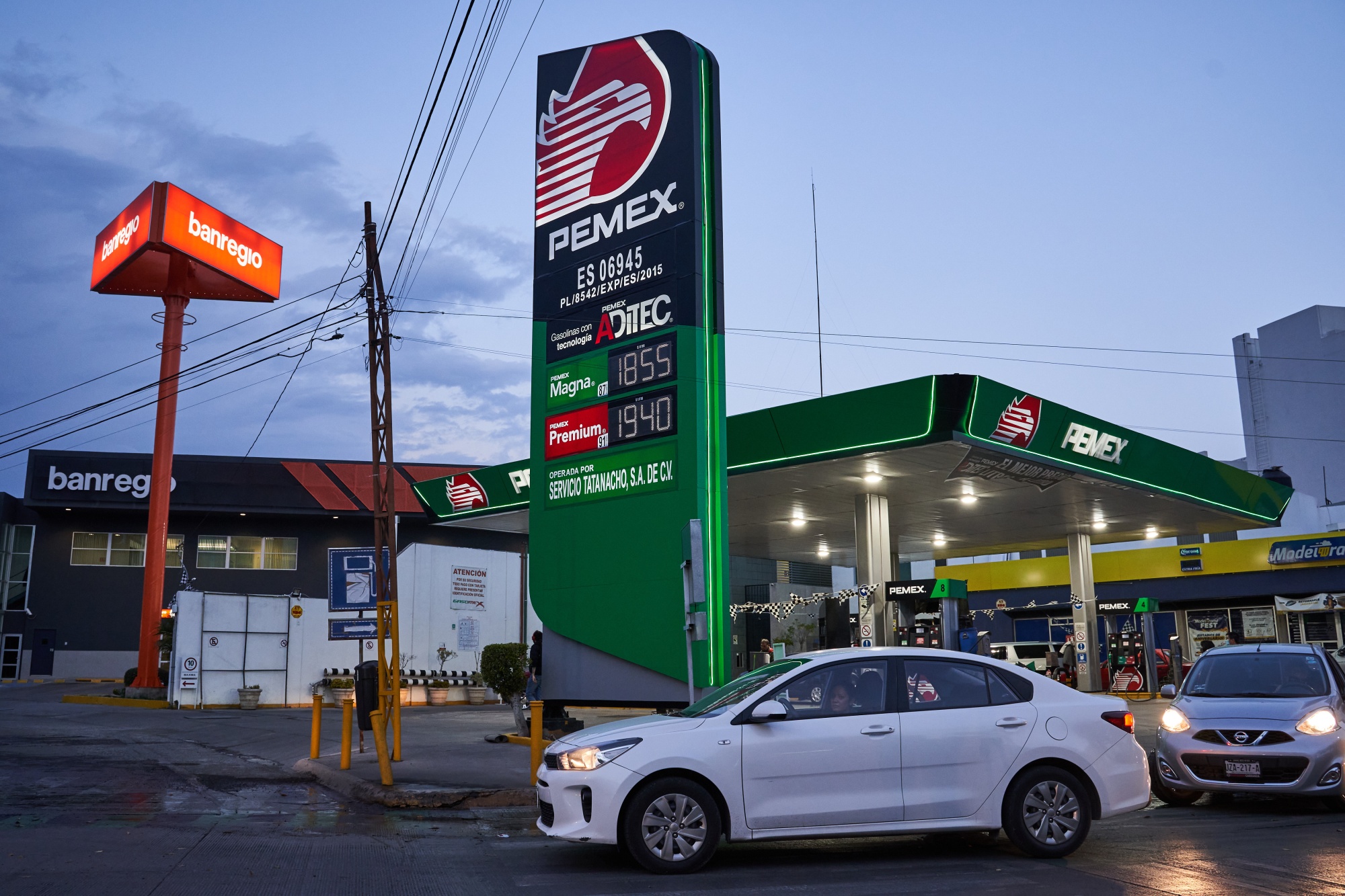 Vehicles pass in front of a Petroleos Mexicanos (Pemex) gas station in San Luis Potosi, Mexico, on Tuesday, Jan. 19, 2021.&nbsp;