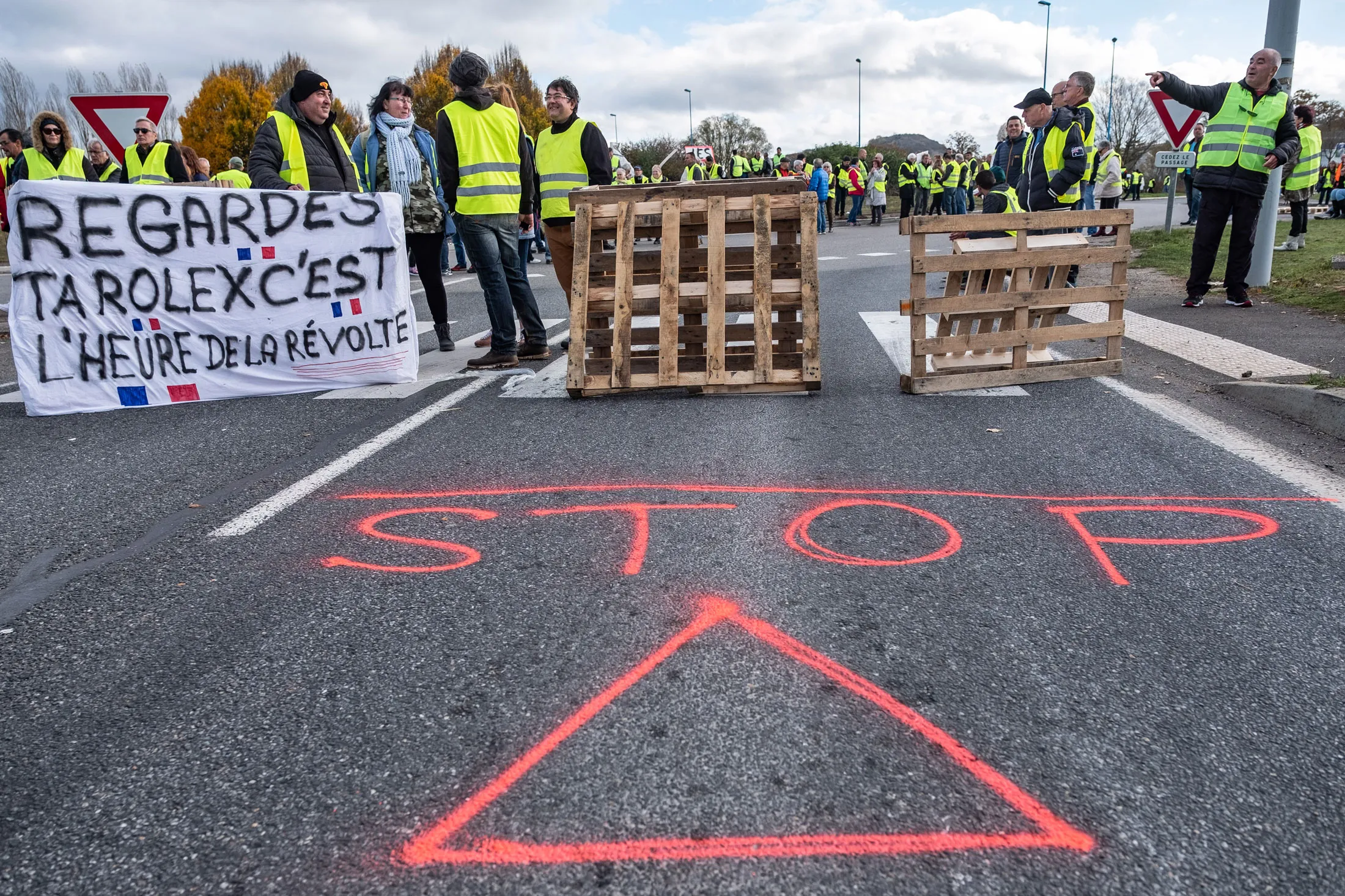 Demonstrators wearing yellow vests (Gilets jaunes) block the highway to Rodez during a protest against fuel costs near Rodez, France, on Saturday, Nov. 17, 2018. One protester was knocked down by a car and died and a series of road accidents were scattered across France Saturday as tensions mounted during the morning hours of grassroots protests against President Emmanuel Macron’s decision to raise gasoline prices.
