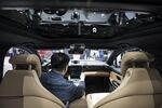 An attendee sits inside the NIO Inc. ES6 electric SUV.
