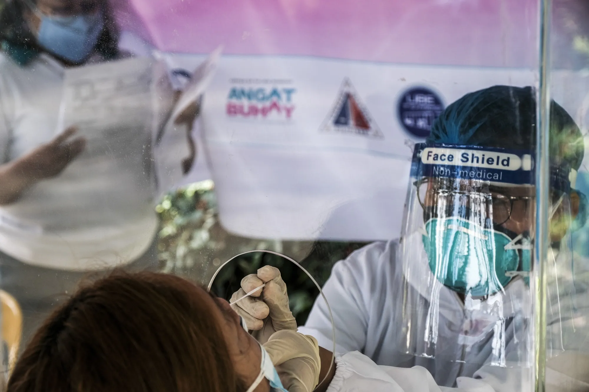 A healthcare worker administers a Covid-19 test in Quezon City, the Philippines, on Jan. 6.