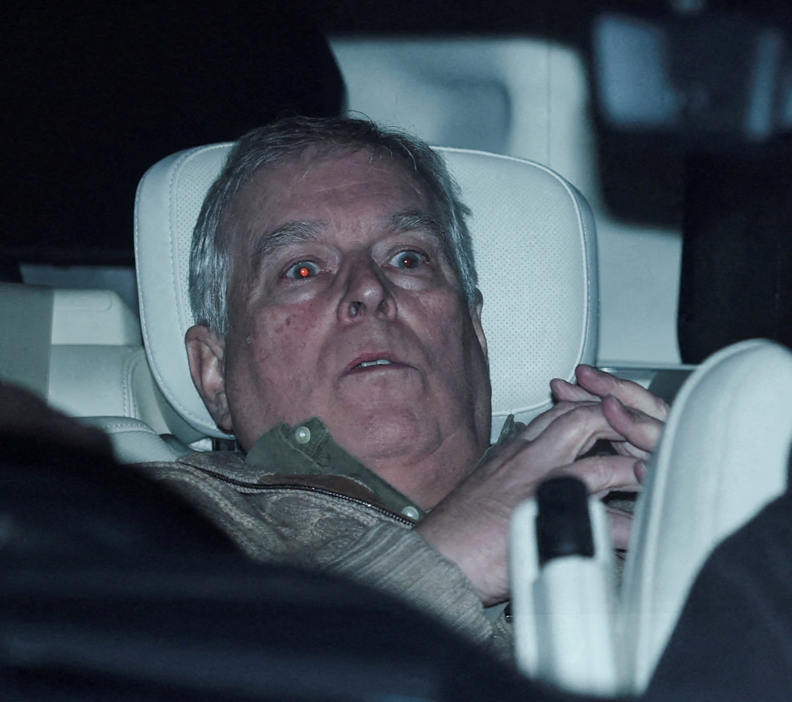Andrew Mountbatten Windsor, younger brother of Britain's King Charles, formerly known as Prince Andrew, leaves Aylsham Police Station on a vehicle, on the day he was arrested on suspicion of misconduct in public office, after the U.S. Justice Department released more records tied to the late financier and convicted sex offender Jeffrey Epstein, in Aylsham, Britain, February 19, 2026. Photographer: Phil Noble/Reuters