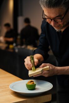 Tsuyoshi Murakami, sushi chef and owner of Murakami restaurant, garnishing his "Uni Lemon."