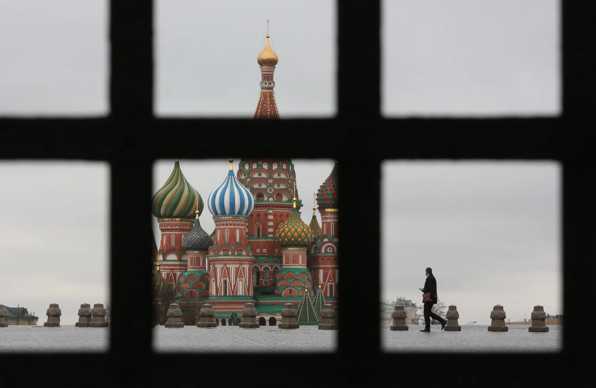 A pedestrian walks in Red Square near the Kremlin in Moscow.