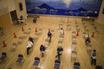 People wait in the observation area at a vaccination site in Naha, Okinawa Prefecture, Japan.