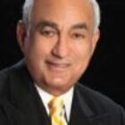 Headshot of John E Abdo