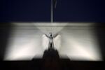 An eagle sculpture stands on the facade of the Marriner S. Eccles Federal Reserve building in Washington.