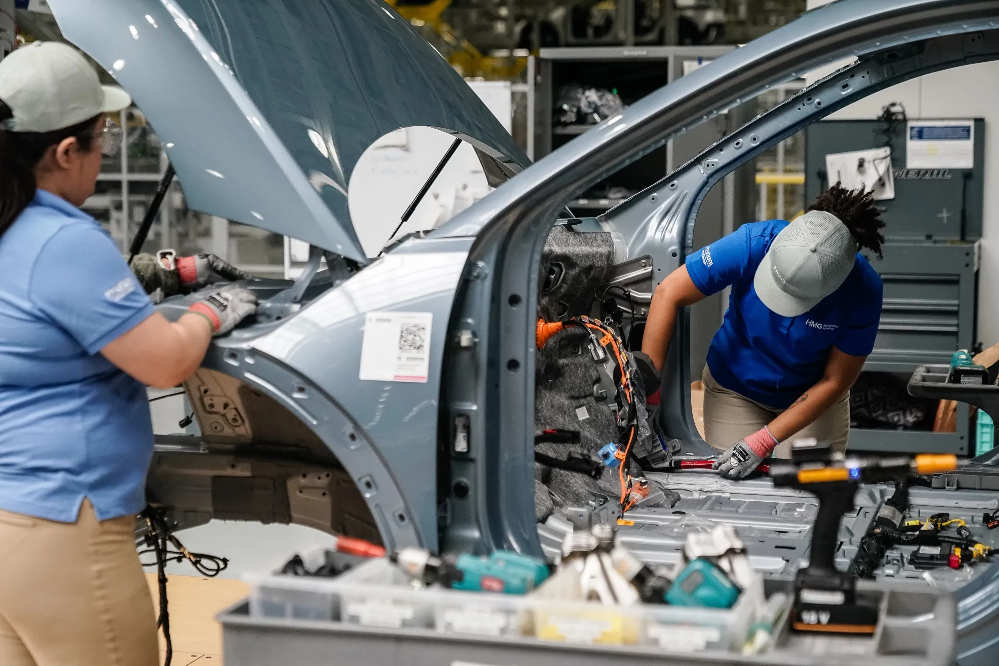 Workers assemble vehicles on the production floor at the Hyundai Metaplant electric vehicle manufacturing facility in Ellabell, Georgia.