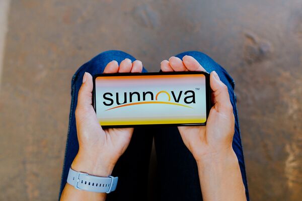 In this photo illustration, the Sunnova Energy logo is