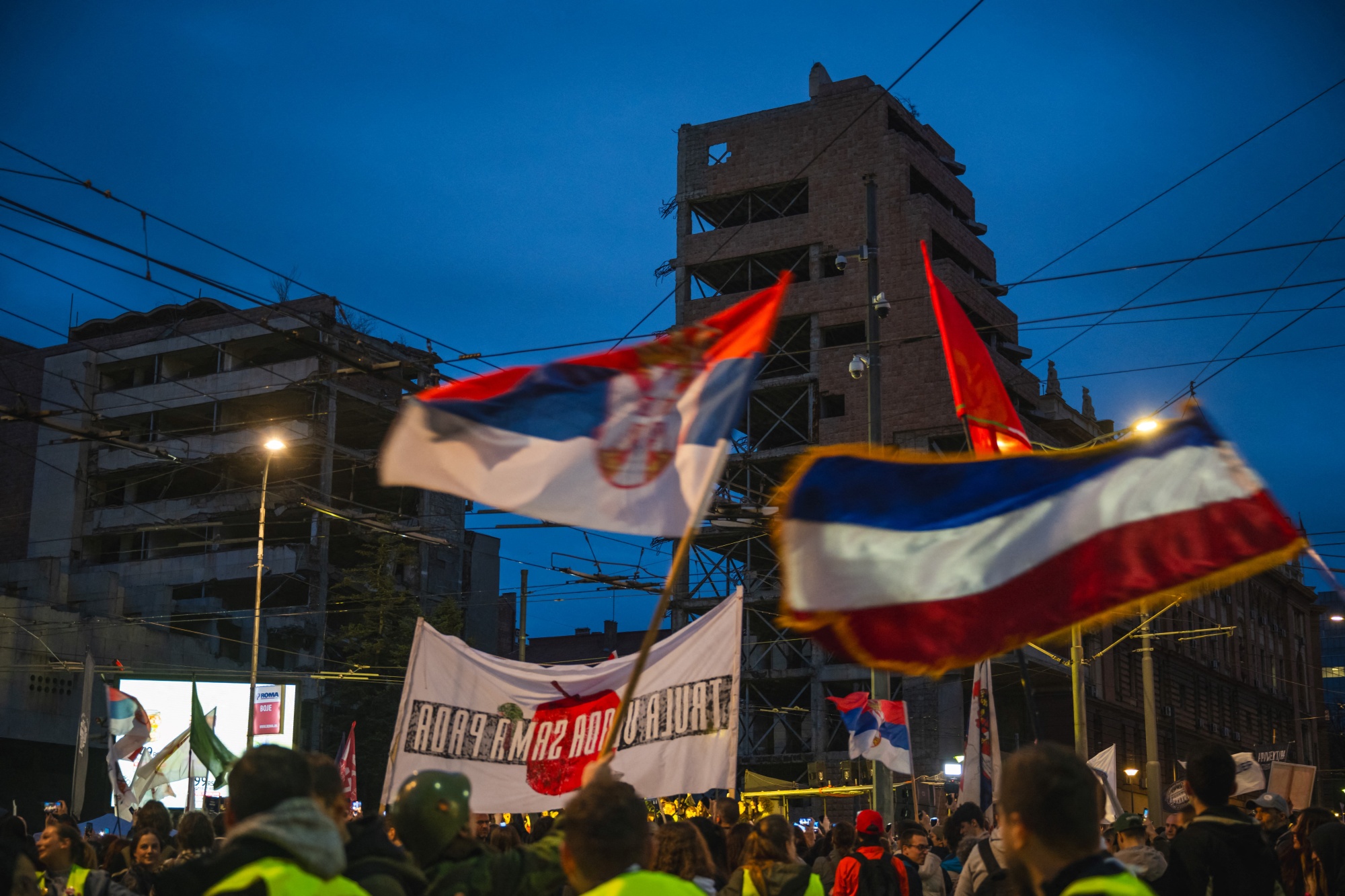 People take part in a protest rally against a real estate development project at the site of the former Yugoslav army headquarters in Belgrade, Serbia, on March 24. Photographer: Andrej Isakovic/AFP/Getty Images
