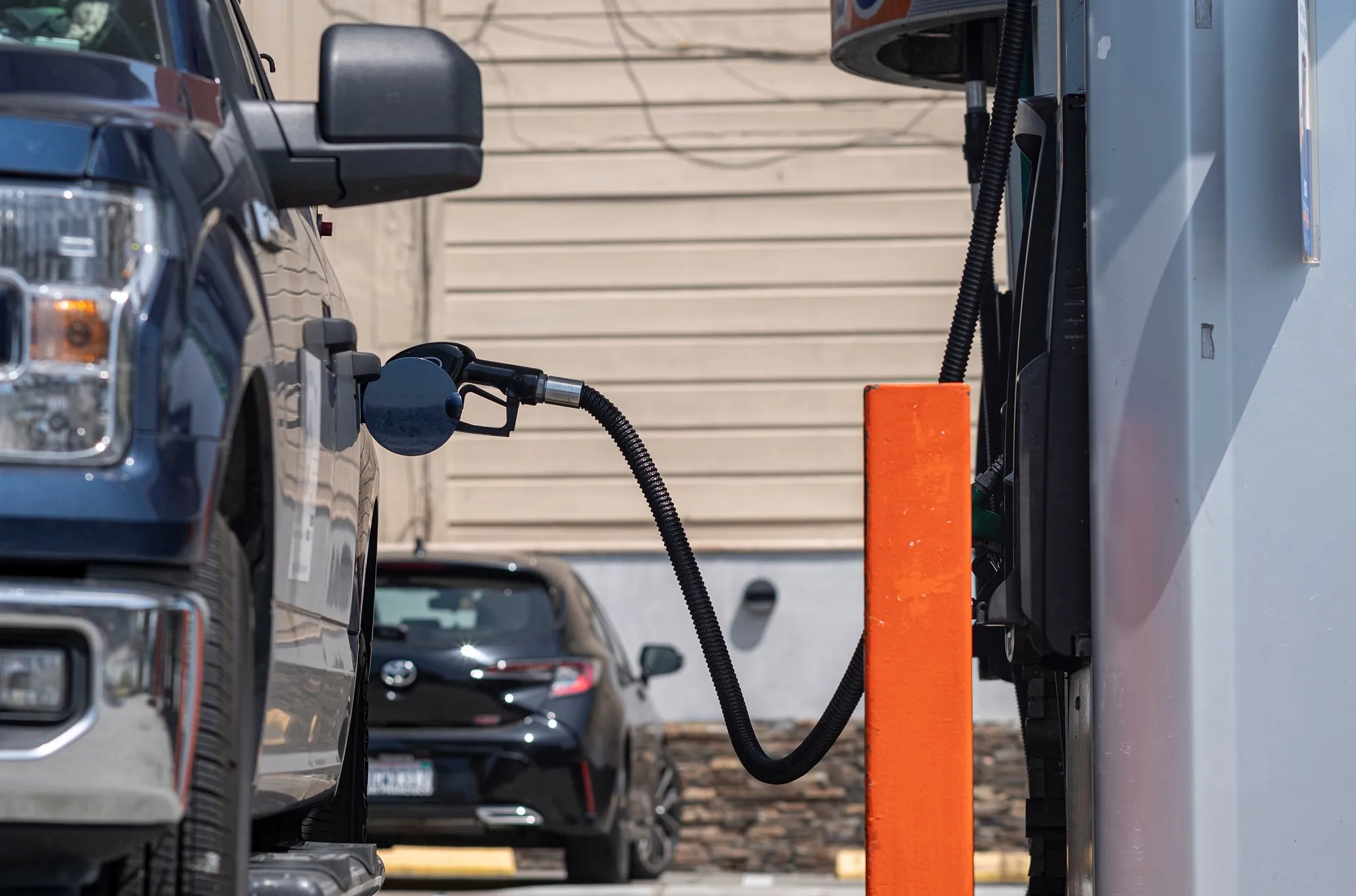 A fuel nozzle in a vehicle at a gas station in San Francisco.