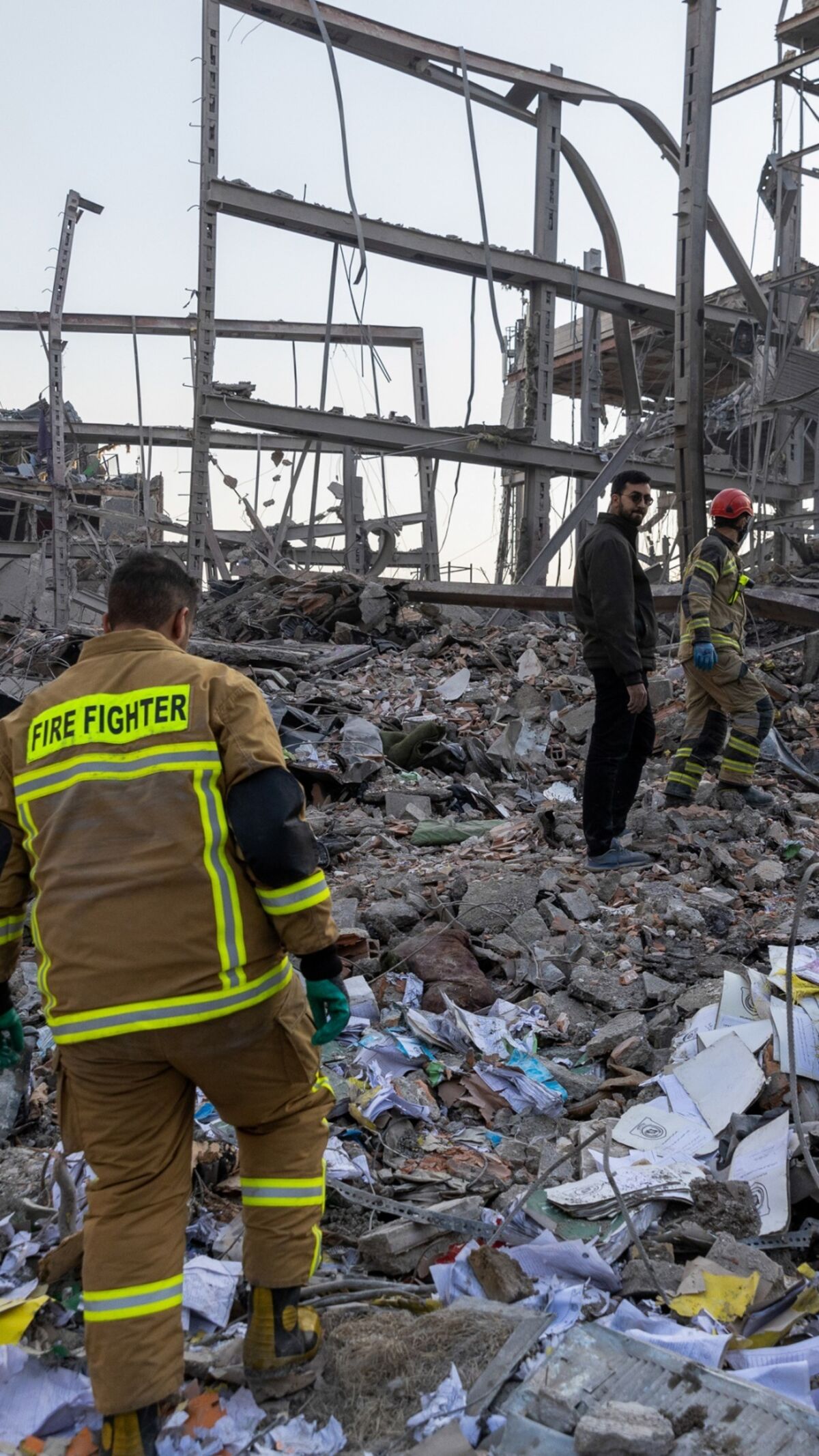 Damaged Buildings, Vehicles Seen After Strikes on Iran