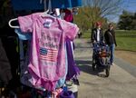 A street vendor sells baby clothes on Constitution Ave in Washington, DC.&nbsp;